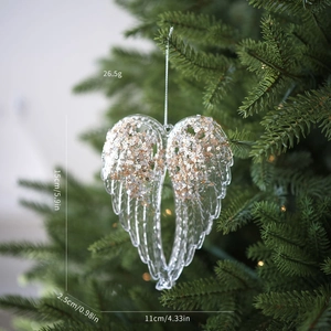 Detail of acrylic heart angel wing pendant with champagne gold sequins on Christmas tree