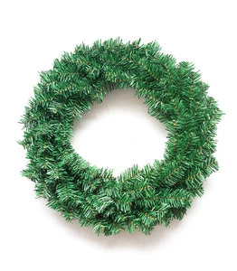 Detail of green PVC artificial Christmas wreath with layered needles on white background