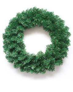 Detail of lush green PVC artificial Christmas wreath with dense pine needles