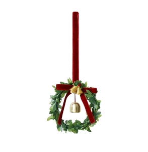 Detail of velvet red bow and golden bell on green festive Christmas wreath decoration