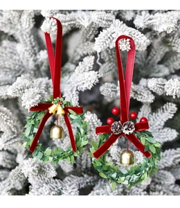 Detail of Christmas wreath ornaments with velvet bows, pine cones and golden bells