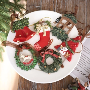 Set of 6 vintage resin Christmas ornaments with stockings and trees on wooden background