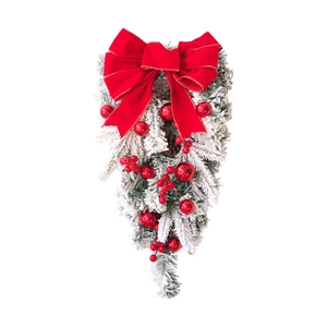 Christmas teardrop swag with red velvet bow, flocked pine branches and berry ornaments