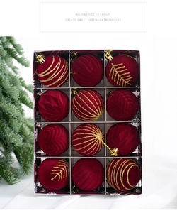 Set of 12 red flocked Christmas balls with gold glitter patterns in a storage box