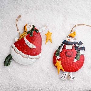 Handcrafted metal Christmas snowman ornaments with rustic textures and hanging ropes