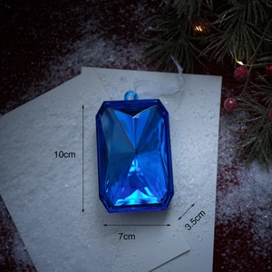 Vista detallada de adorno navideño azul estrellado en forma de gema de 10x7x3.5cm