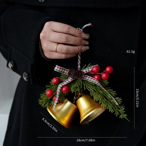 Detailed view of Christmas bell ornament with pine needles, berries and size dimensions