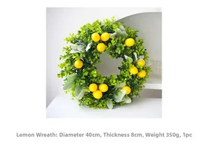 Detail of 40cm lemon wreath with yellow fruits and green leaves for summer home decor