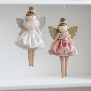 Detail of plush angel dolls featuring sparkling wings and delicate ballet dresses
