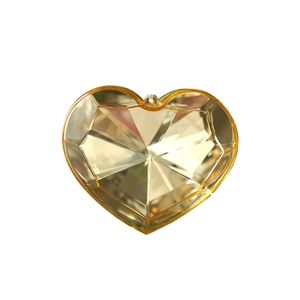 Faceted amber acrylic heart ornament with geometric light refraction for Christmas decor