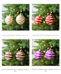 Detail of 8cm glitter Christmas ornaments with wavy texture on a festive tree branch