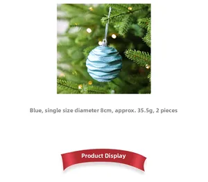 Close-up of 8cm blue Christmas ball with wave texture and silver glitter on tree