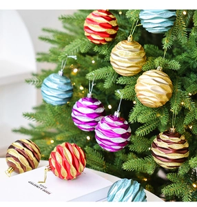 Detail of 8cm Christmas ball ornaments with 3D wave textures and golden glitter stripes