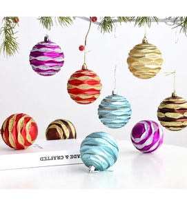 Detail of 8cm Christmas balls with wave textures and glitter on pine branches