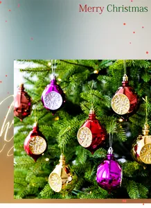Close-up of glittery teardrop and onion shaped Christmas ornaments on a festive tree