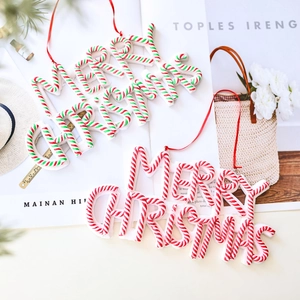 Merry Christmas polymer clay hanging ornaments with festive candy cane stripe designs