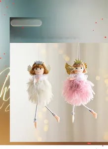 Detailed close-up of a plush pink Christmas angel doll with golden crown and heart wand
