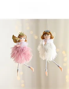 Detail of pink and white plush angel ornaments with glitter crowns and mesh dresses
