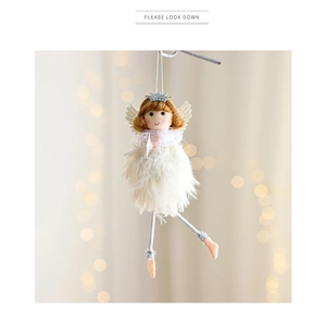 Detailed view of angel doll ornament with cream feather skirt and glitter crown for Christmas