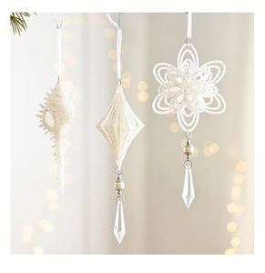 White glitter Christmas ornaments featuring spiral, diamond, and snowflake shapes with crystal drops