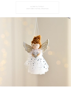 Detail of plush angel ornament with silver glitter wings and sequined white mesh skirt