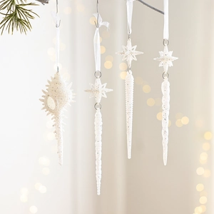 White frosted glitter Christmas ornaments set featuring spiral shell and star icicle shapes