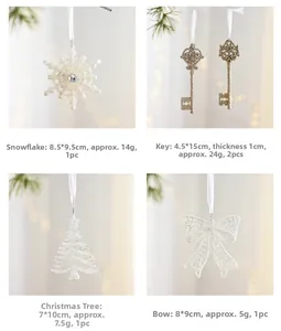 White glitter Christmas ornaments featuring snowflake, key, tree, and bow shapes with ribbons