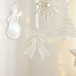 Sparkly white Christmas ornament set with snowmen, snowflakes and trees for decoration