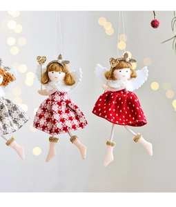 Detailed view of three plush Christmas angel dolls with plaid skirts and white wings