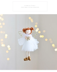 Detailed view of white mesh Christmas angel ornament with golden snowflake and wire wings