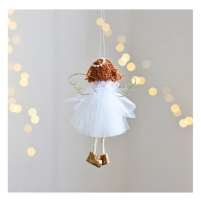 Macro detail of Christmas angel ornament with white mesh skirt and golden wire wings