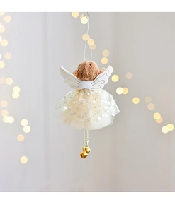 Detail of Christmas angel tree topper with mesh skirt and golden wing embroidery