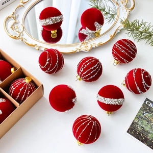 Set of burgundy velvet Christmas ornaments with gold caps and festive glitter decor