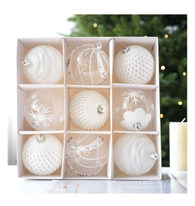 Set of 9 white and clear Christmas ball ornaments with snowflake and glitter patterns