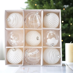 9-piece set of white and clear Christmas ornaments in a grid gift box with festive decor