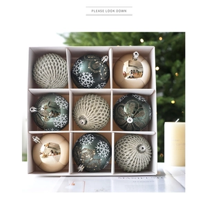 Set of nine emerald green Christmas ball ornaments with snowflake patterns and glitter texture