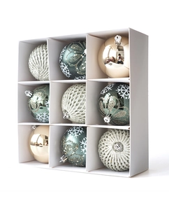 Nine-piece set of textured knit, emerald green snowflake, and gold mirror Christmas ornaments