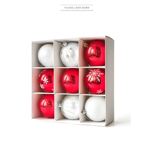 Detailed view of nine 8cm hand-painted Christmas balls in a white gift box