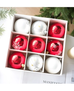 Detail view of 9-piece 8cm Christmas ball set with snowflake and star patterns in a box