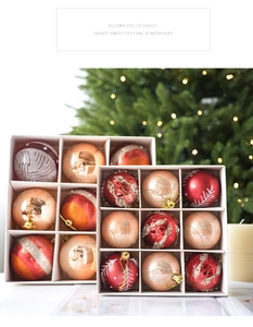 Detail view of red and gold Christmas ball ornaments with glitter snowflake patterns