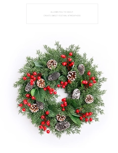 Detailed view of Christmas candle ring with pine needles, red berries, and natural pine cones