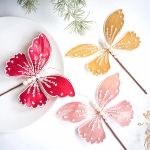 Three sequined fabric butterfly stakes in red, yellow and pink for Christmas tree decor