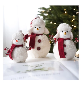 Three plush Christmas snowmen with red knit scarves and hats in varying sizes