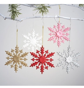 Glittery 10cm snowflake ornaments in 5 colors hanging on frosted pine branch