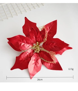Detail showing red velvet Christmas flower with gold sequins and hollow mesh petals
