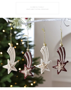 Detail of star-shaped Christmas ornaments with glitter in burgundy and champagne finish