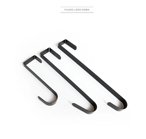 Three-piece set of matte black metal over-the-door hooks for wreaths and holiday decor