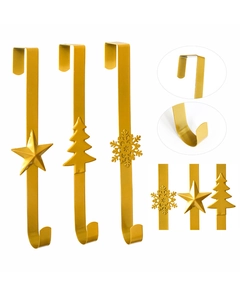 Close-up of gold metal wreath hooks with star, tree, and snowflake detail designs