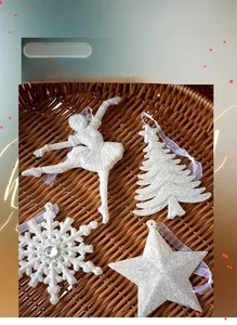 Set of four white glitter Christmas ornaments including angel, star, and snowflake