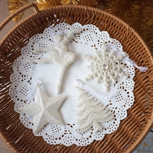 Sparkling white Christmas ornaments set with star, snowflake, and ballet dancer shapes